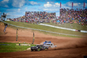 CJ Greaves leads the field through turn one at Bark River Raceway